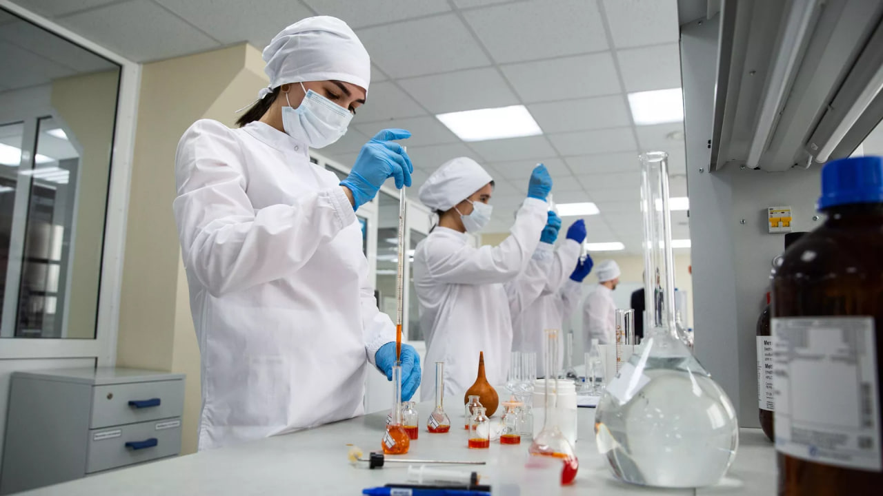 How much does Tajikistan import and produce medicines?