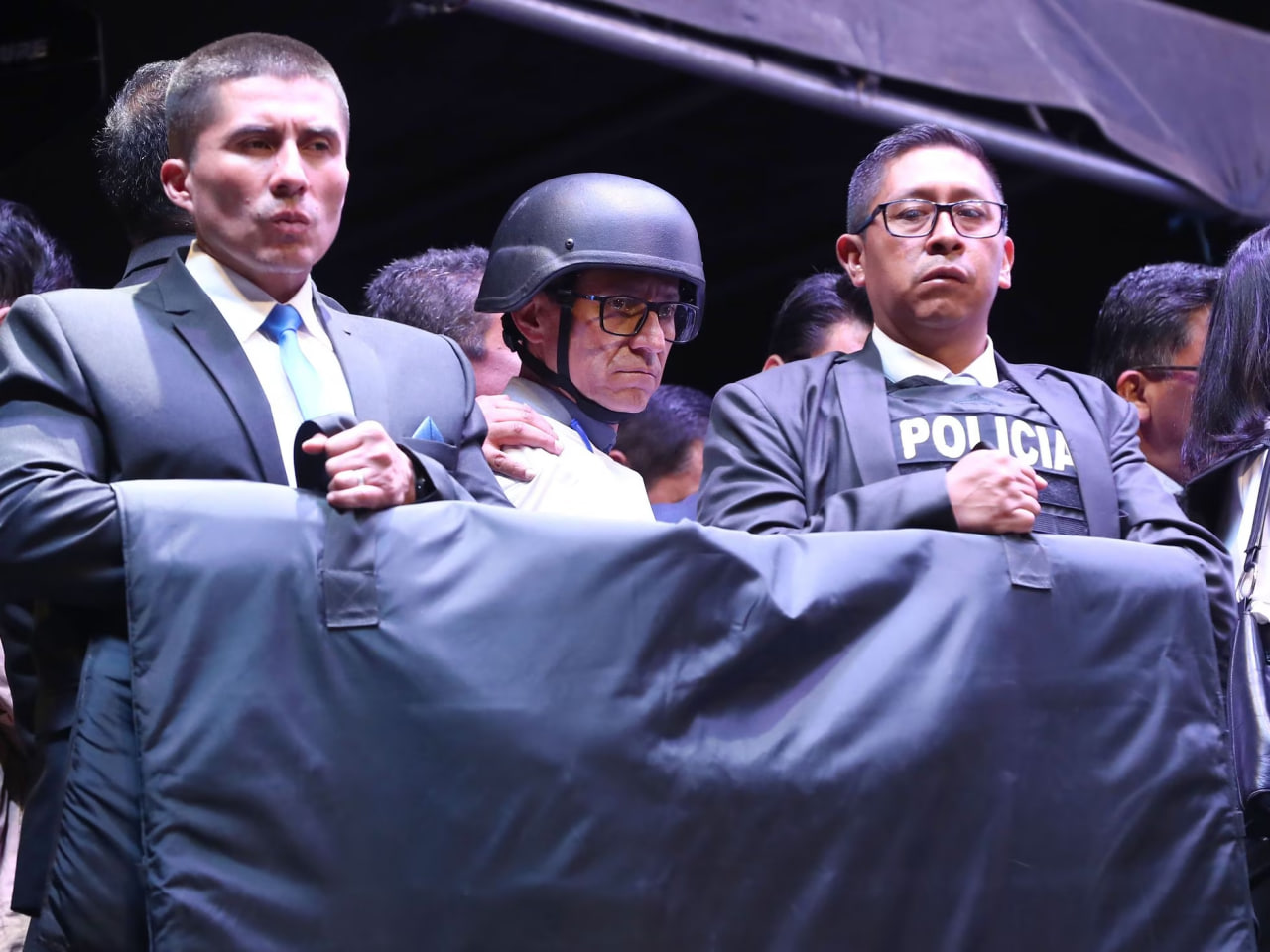 In Ecuador, presidential candidates came to the polls wearing bulletproof vests and helmets