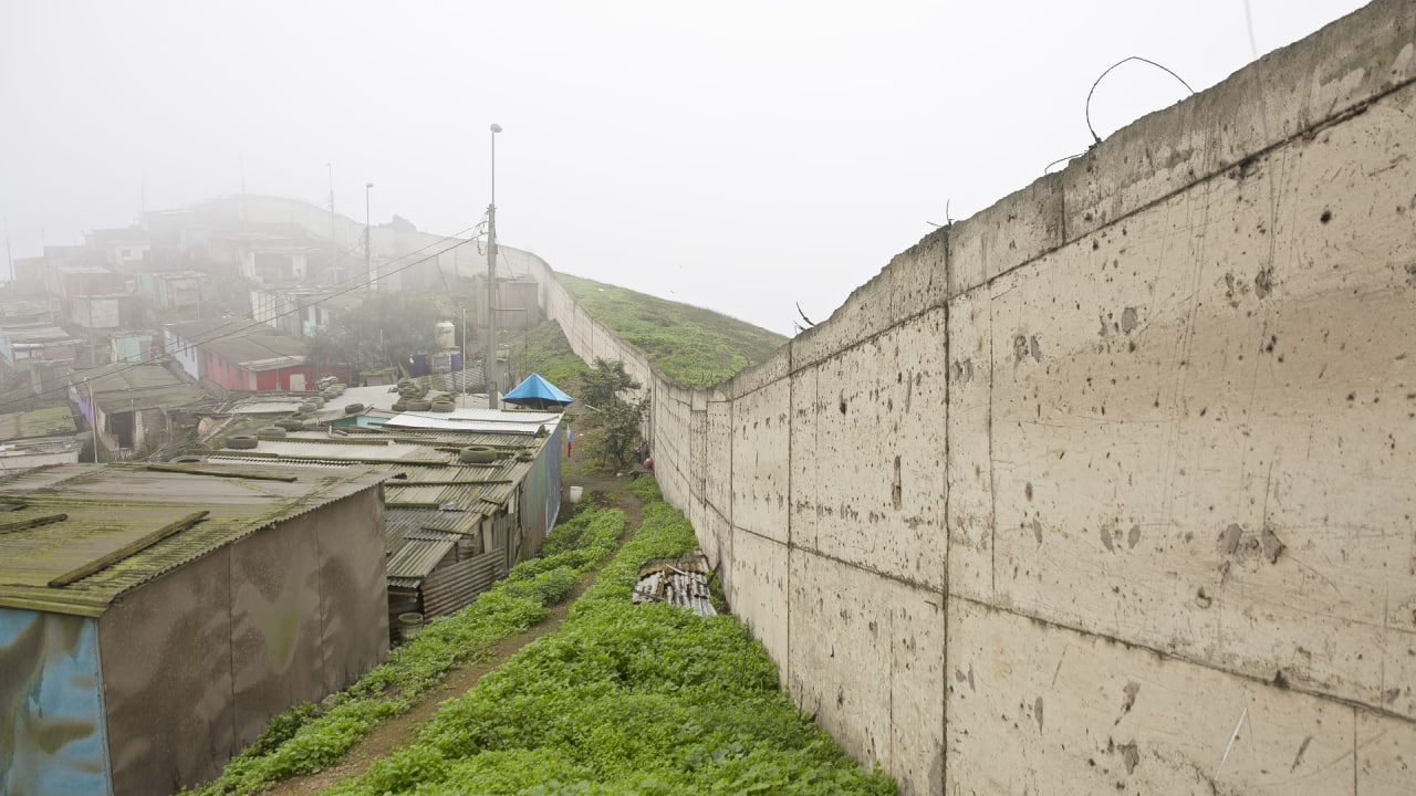 In Peru, the “wall of shame” that separates the rich from the poor is being broken