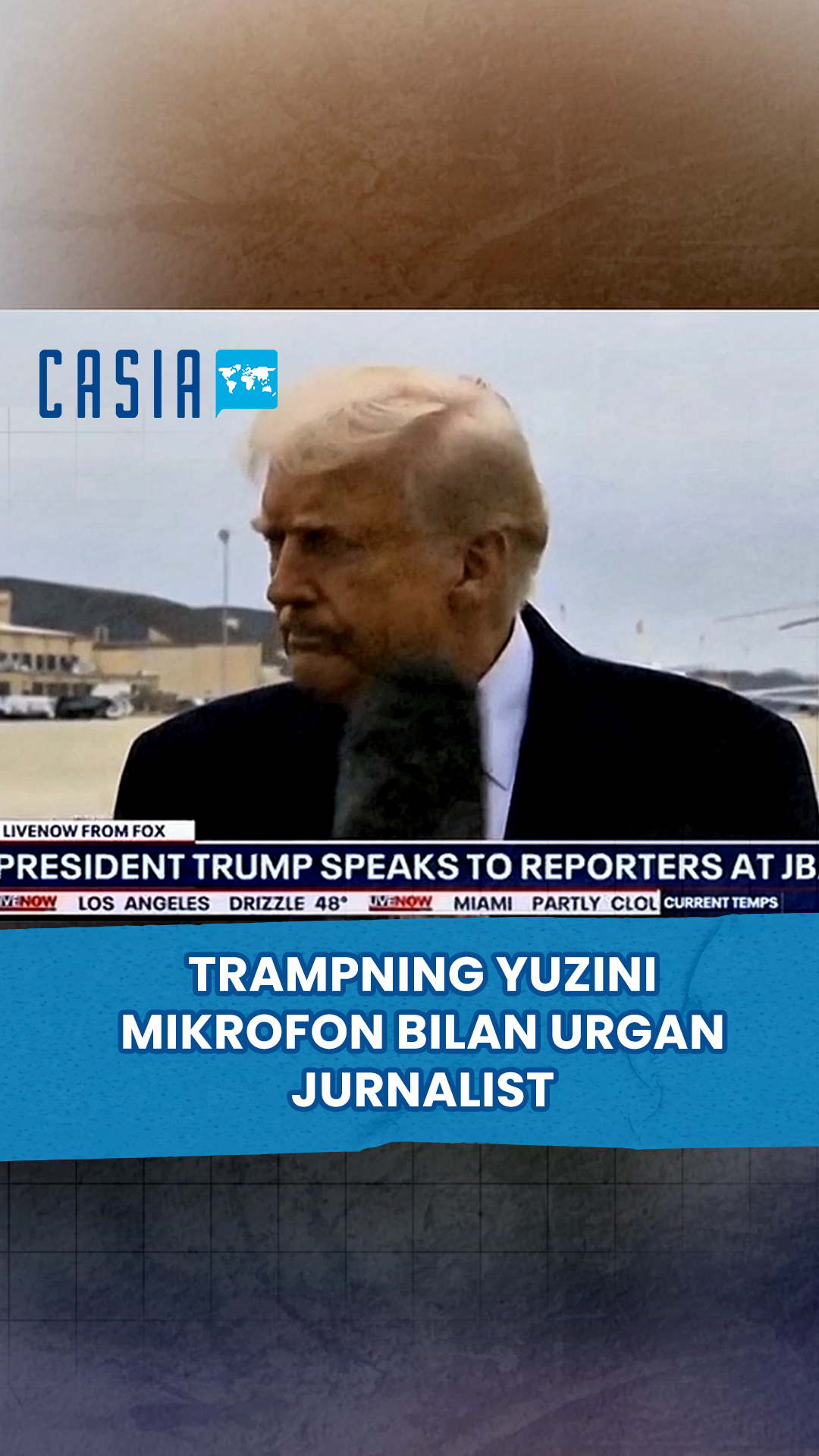 Journalist hits Trump in the face with microphone