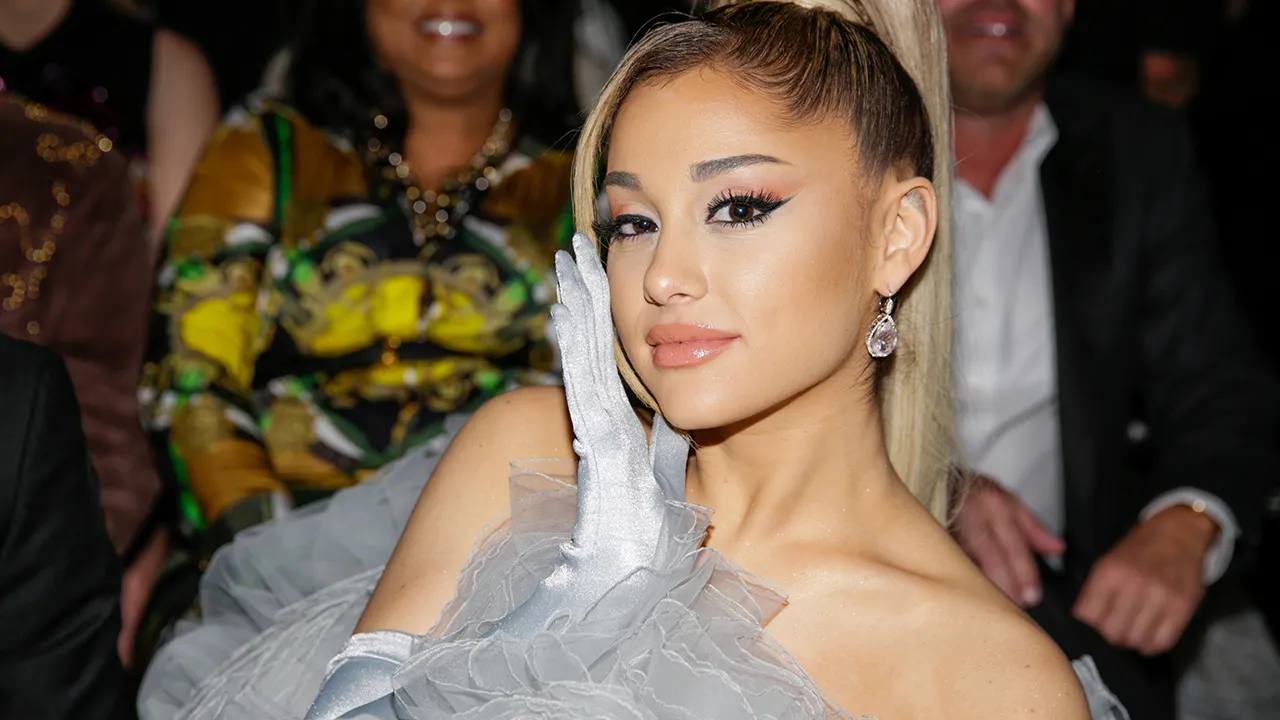 Why did Ariana Grande sue hackers?
