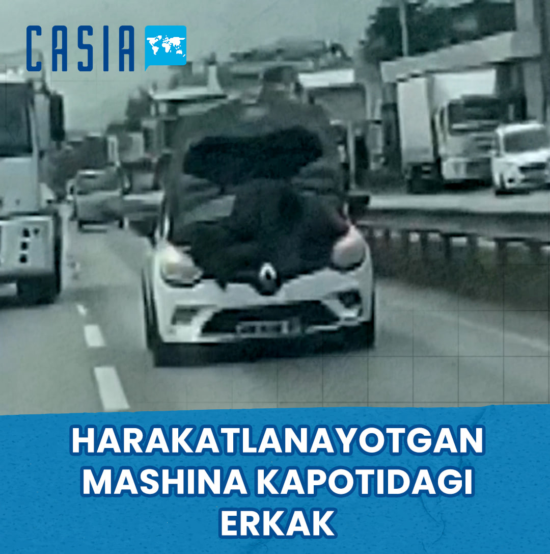 Man in Turkey Repairs Engine on the Hood of a Moving Car